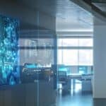 a sleek, modern office space featuring a large screen displaying a digital identity verification interface, exuding professionalism and high-tech efficiency, with a sharp focus on the glowing biometric elements and user-friendly design.